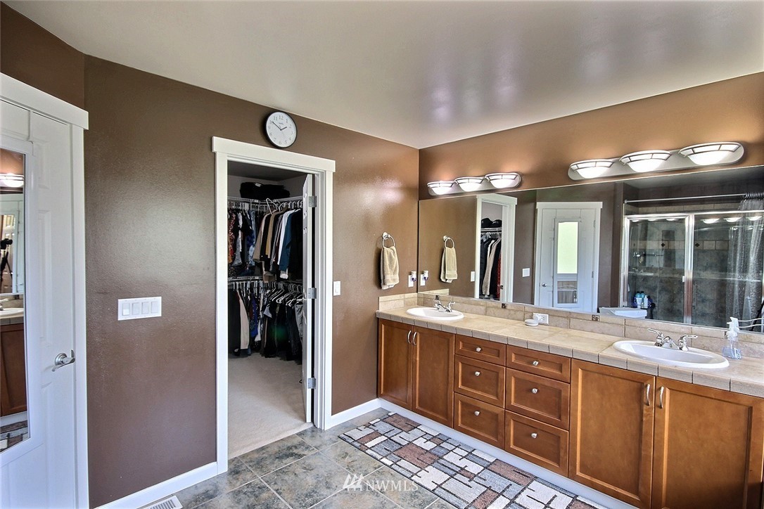 12946 Southeast 216th Place Kent, WA 98031 - Photo 25 of 39 a bathroom with a sink and a mirror