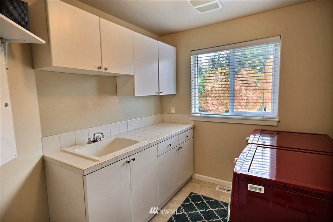 12946 Southeast 216th Place Kent, WA 98031 - Photo 30 of 39 a room with storage and utility