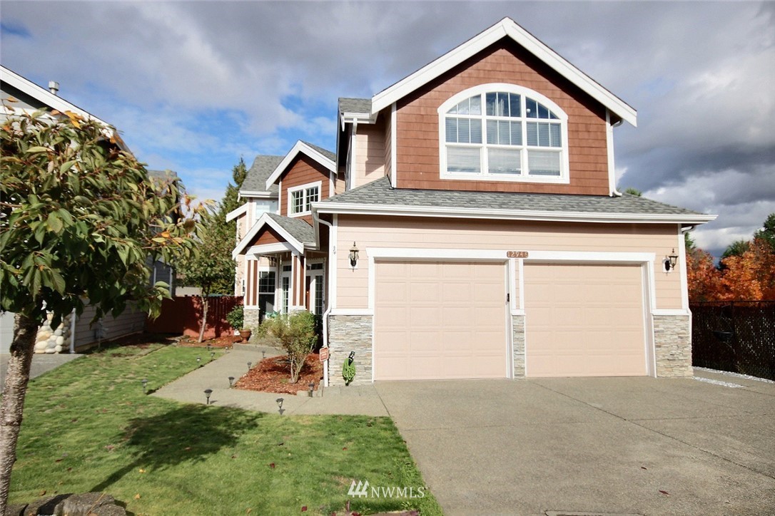 12946 Southeast 216th Place Kent, WA 98031 - Photo 35 of 39 front view of house with a yard