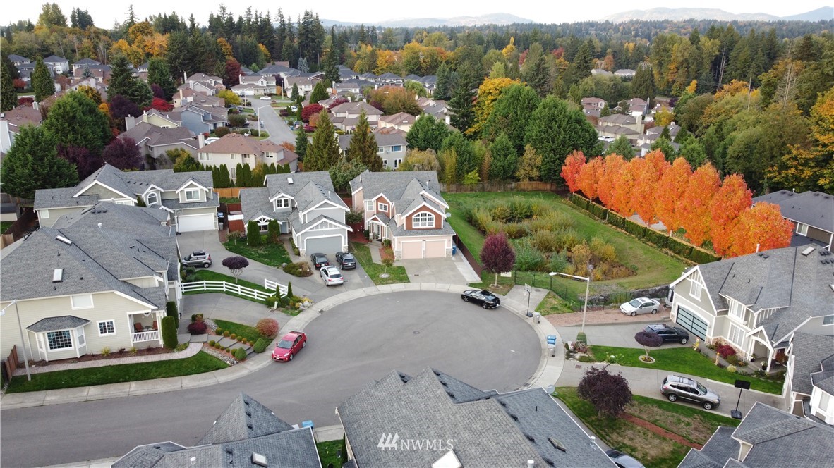 12946 Southeast 216th Place Kent, WA 98031 - Photo 38 of 39 an aerial view of residential houses with outdoor space