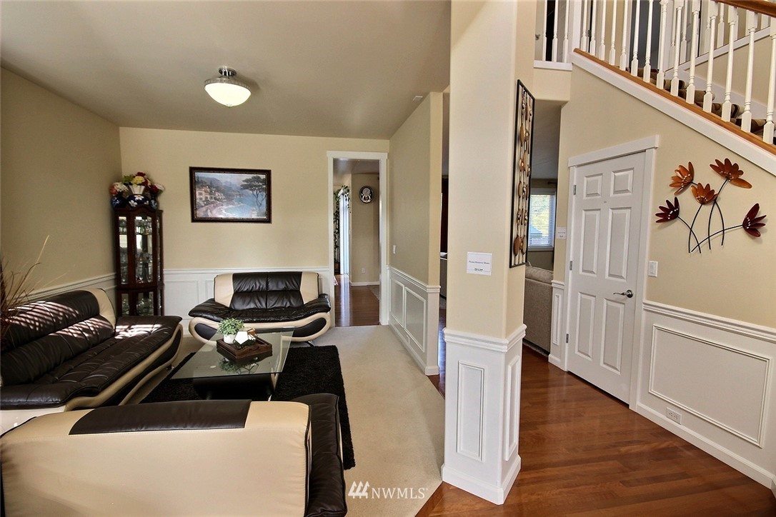 12946 Southeast 216th Place Kent, WA 98031 - Photo 6 of 39 a bedroom with furniture and a wooden floor