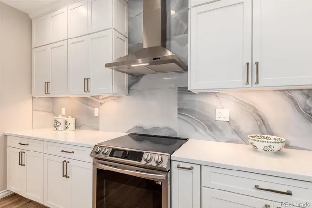 a kitchen with a stove and cabinets