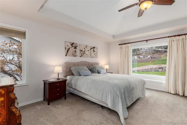 a spacious bedroom with a bed and a window