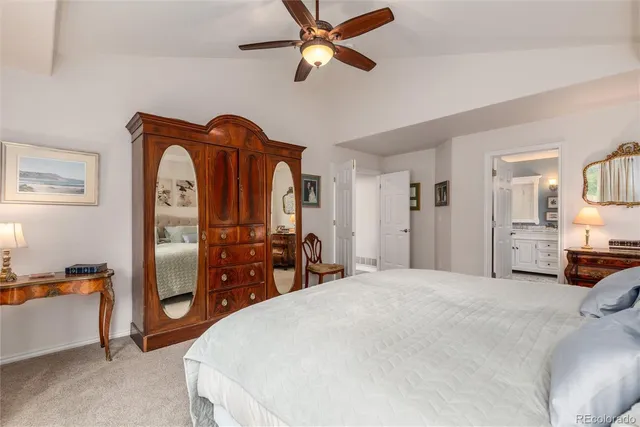 a bedroom with bed and wooden floor