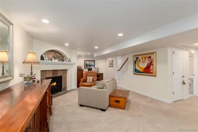 a living room with furniture and a fireplace