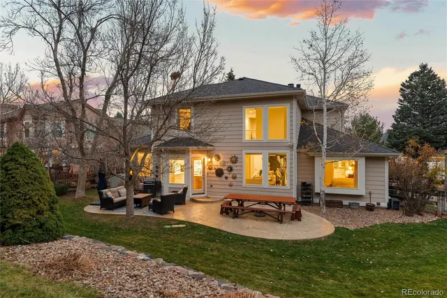 a view of a house with swimming pool and sitting area