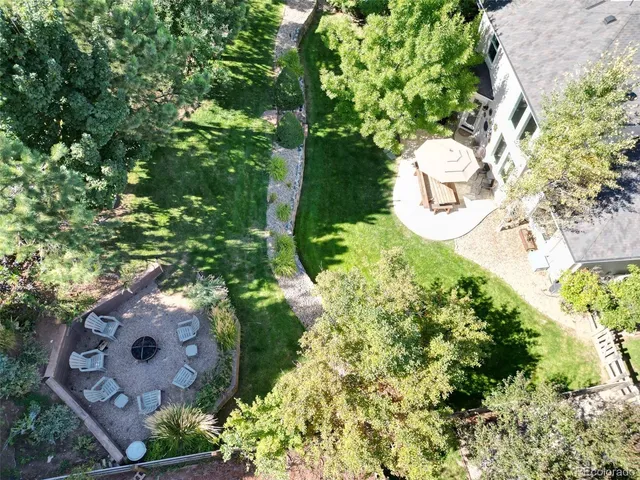 an aerial view of a backyard of the house