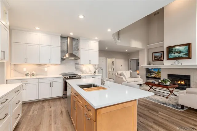 a kitchen with a stove a sink and a refrigerator