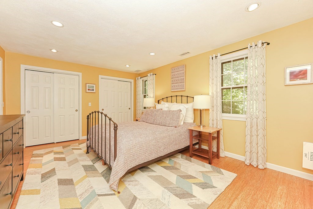 9 Apple Ridge Road, Unit 4 Maynard, MA 01754 - Photo 15 of 33 a view of a bedroom with wooden floor and furniture