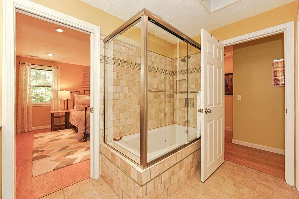 9 Apple Ridge Road, Unit 4 Maynard, MA 01754 - Photo 19 of 33 a en suite bathroom with a shower