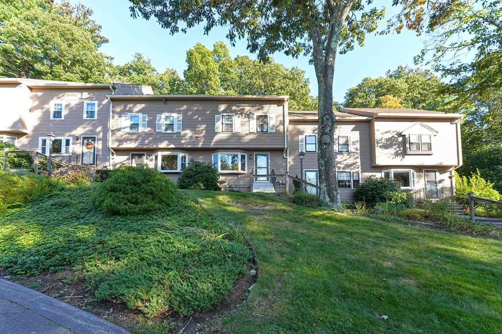 9 Apple Ridge Road, Unit 4 Maynard, MA 01754 - Photo 2 of 33 a view of a residential apartment building with a yard