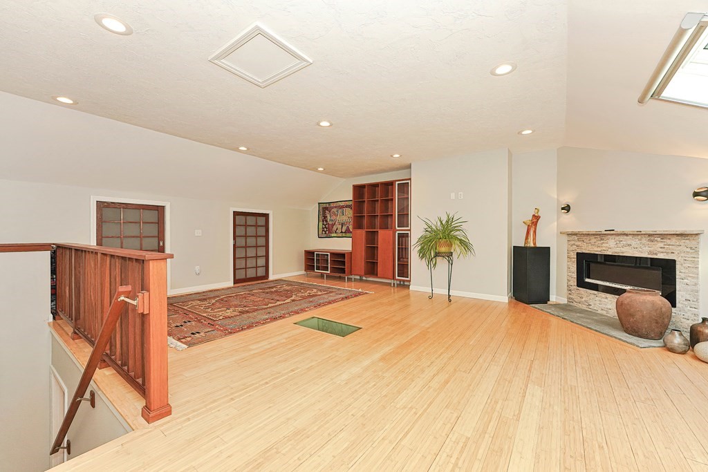 9 Apple Ridge Road, Unit 4 Maynard, MA 01754 - Photo 23 of 33 a bed room with a bed and a television