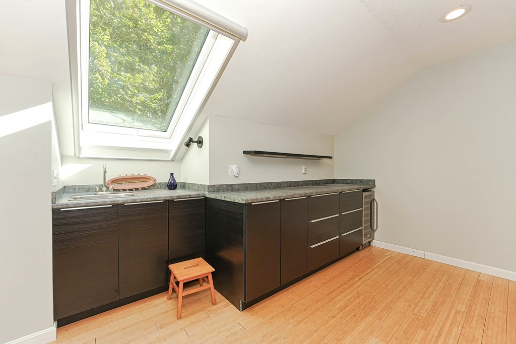 9 Apple Ridge Road, Unit 4 Maynard, MA 01754 - Photo 26 of 33 a room with furniture and window