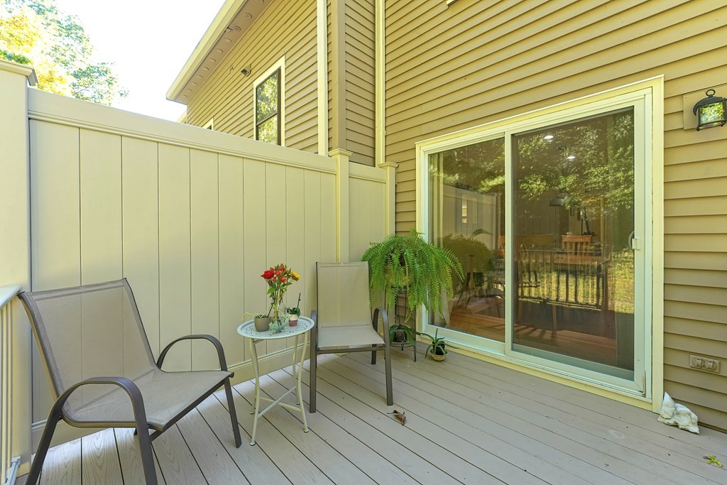 9 Apple Ridge Road, Unit 4 Maynard, MA 01754 - Photo 27 of 33 a backyard of a house with seating space