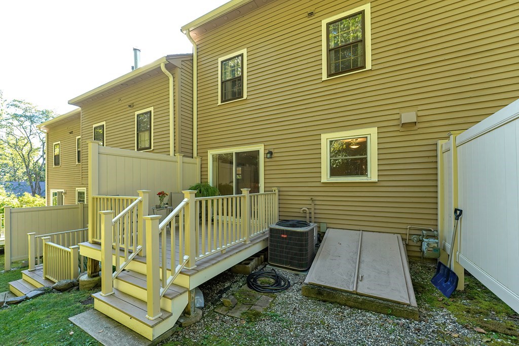 9 Apple Ridge Road, Unit 4 Maynard, MA 01754 - Photo 29 of 33 a view of a house with a yard
