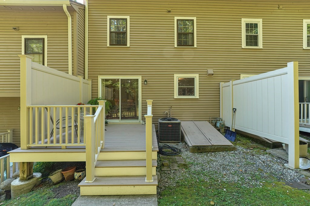 9 Apple Ridge Road, Unit 4 Maynard, MA 01754 - Photo 30 of 33 a front view of a house with a garden