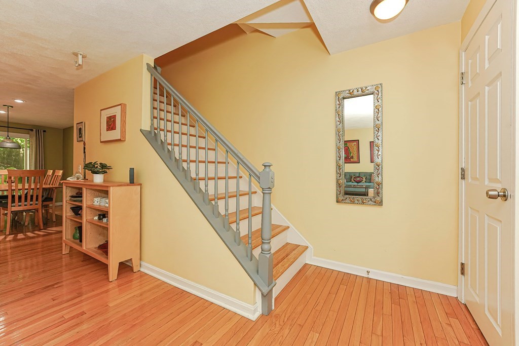 9 Apple Ridge Road, Unit 4 Maynard, MA 01754 - Photo 3 of 33 a view of front door with wooden floor and stairs