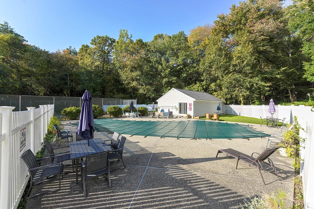 9 Apple Ridge Road, Unit 4 Maynard, MA 01754 - Photo 33 of 33 a view of a table and chairs in patio