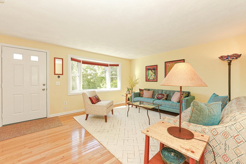 9 Apple Ridge Road, Unit 4 Maynard, MA 01754 - Photo 4 of 33 a living room with furniture and wooden floor