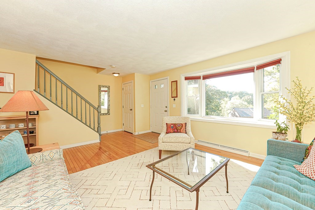 9 Apple Ridge Road, Unit 4 Maynard, MA 01754 - Photo 5 of 33 a living room with furniture and a window