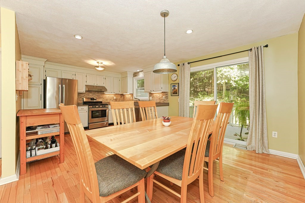 9 Apple Ridge Road, Unit 4 Maynard, MA 01754 - Photo 8 of 33 a dining room with furniture and wooden floor
