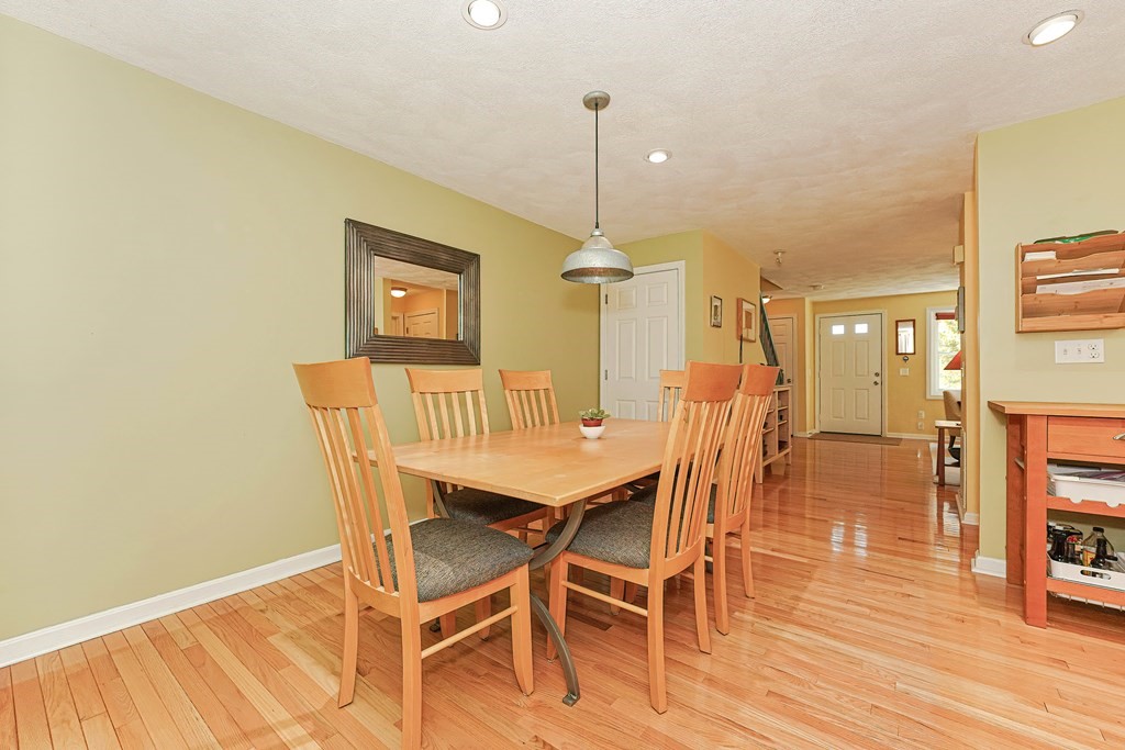 9 Apple Ridge Road, Unit 4 Maynard, MA 01754 - Photo 9 of 33 a dining room with furniture and wooden floor