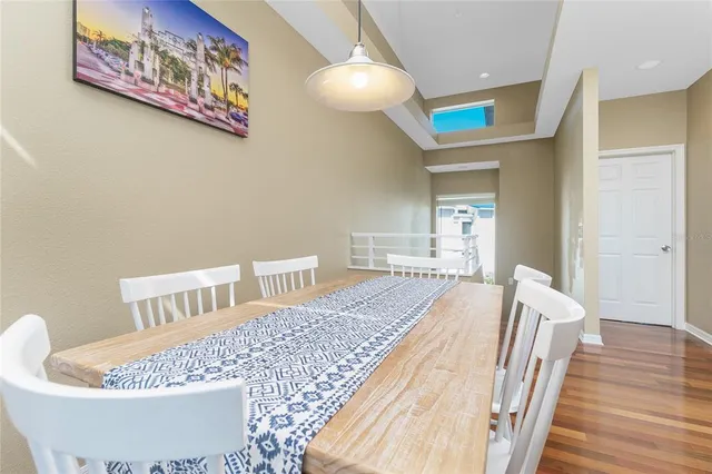 a room with a bed and wooden floor