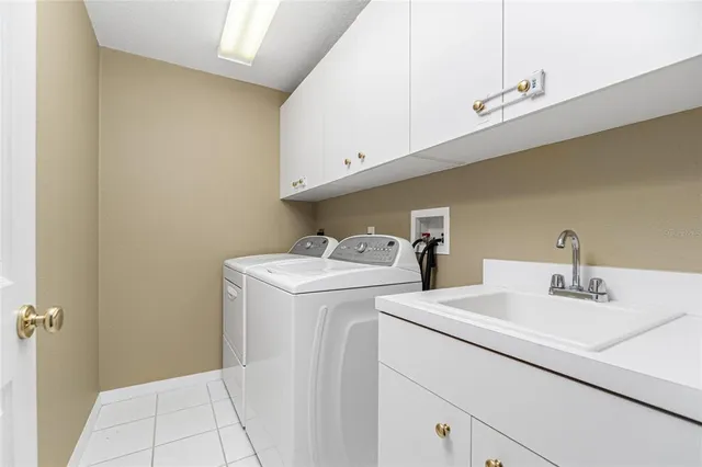 a view of a bedroom with a bed and wooden floor