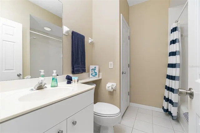 a living room with a bed furniture and a window