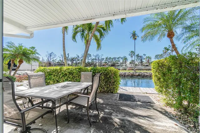 a view of a lake with boats and trees in the background
