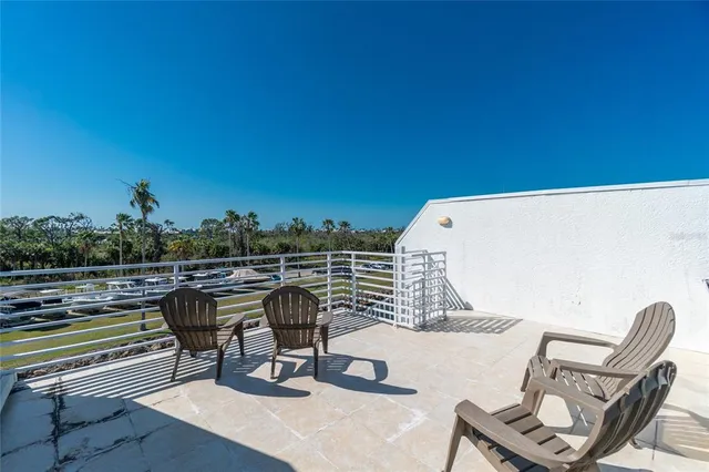 an aerial view of a city with lawn chairs