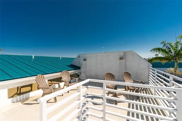 an aerial view of a house with a ocean view