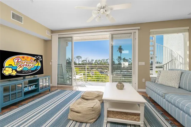 a living room with fireplace furniture and a flat screen tv