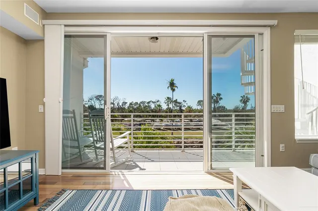 a kitchen with stainless steel appliances kitchen island a refrigerator sink and stove