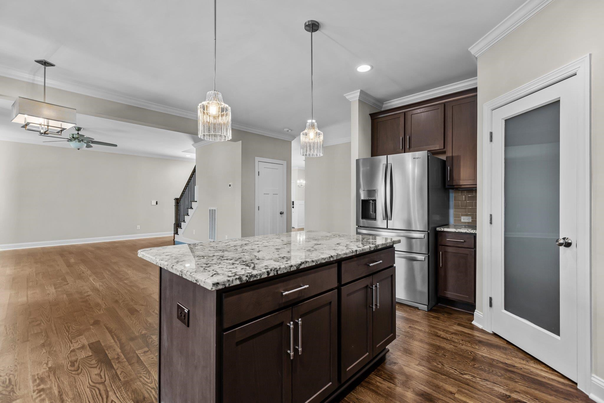 357 Marshcroft Way Rolesville, NC 27571 - Photo 16 of 52 a kitchen with stainless steel appliances kitchen island a refrigerator and a sink