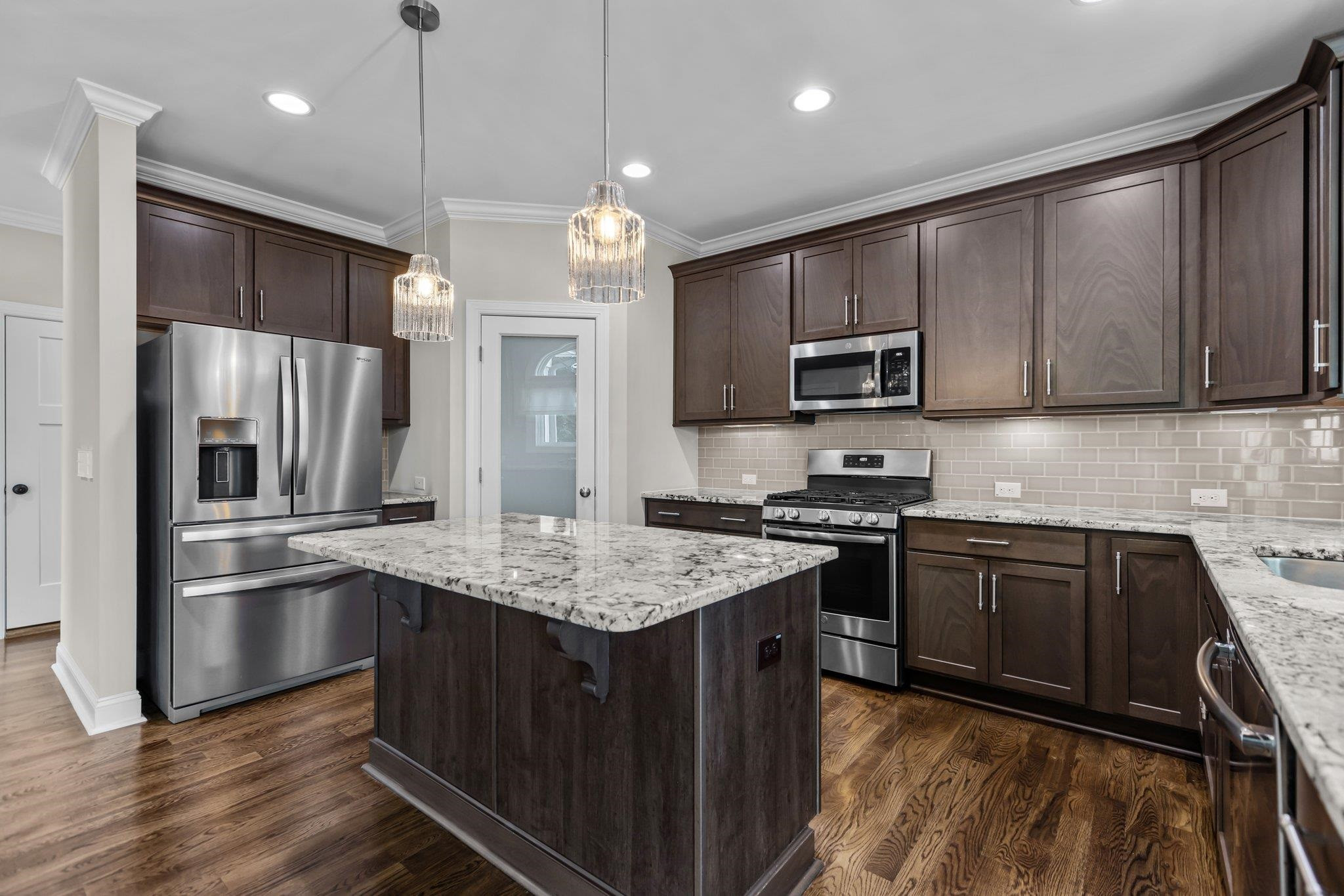 357 Marshcroft Way Rolesville, NC 27571 - Photo 17 of 52 a kitchen with stainless steel appliances granite countertop a stove refrigerator sink and microwave