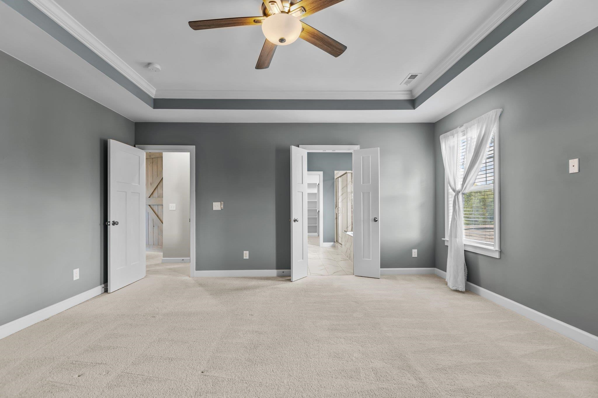 357 Marshcroft Way Rolesville, NC 27571 - Photo 27 of 52 a view of a livingroom with a ceiling fan and window