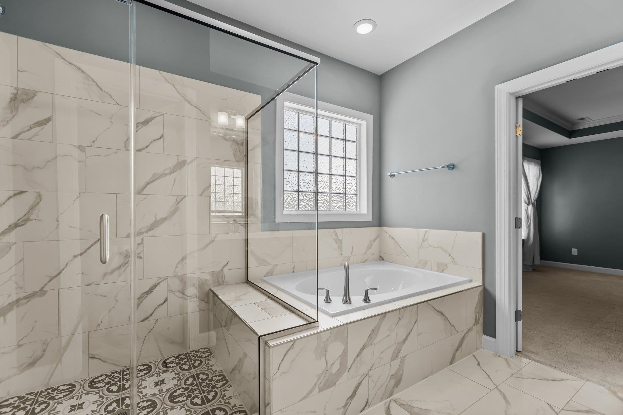 357 Marshcroft Way Rolesville, NC 27571 - Photo 30 of 52 a bathroom with a bathtub and a shower