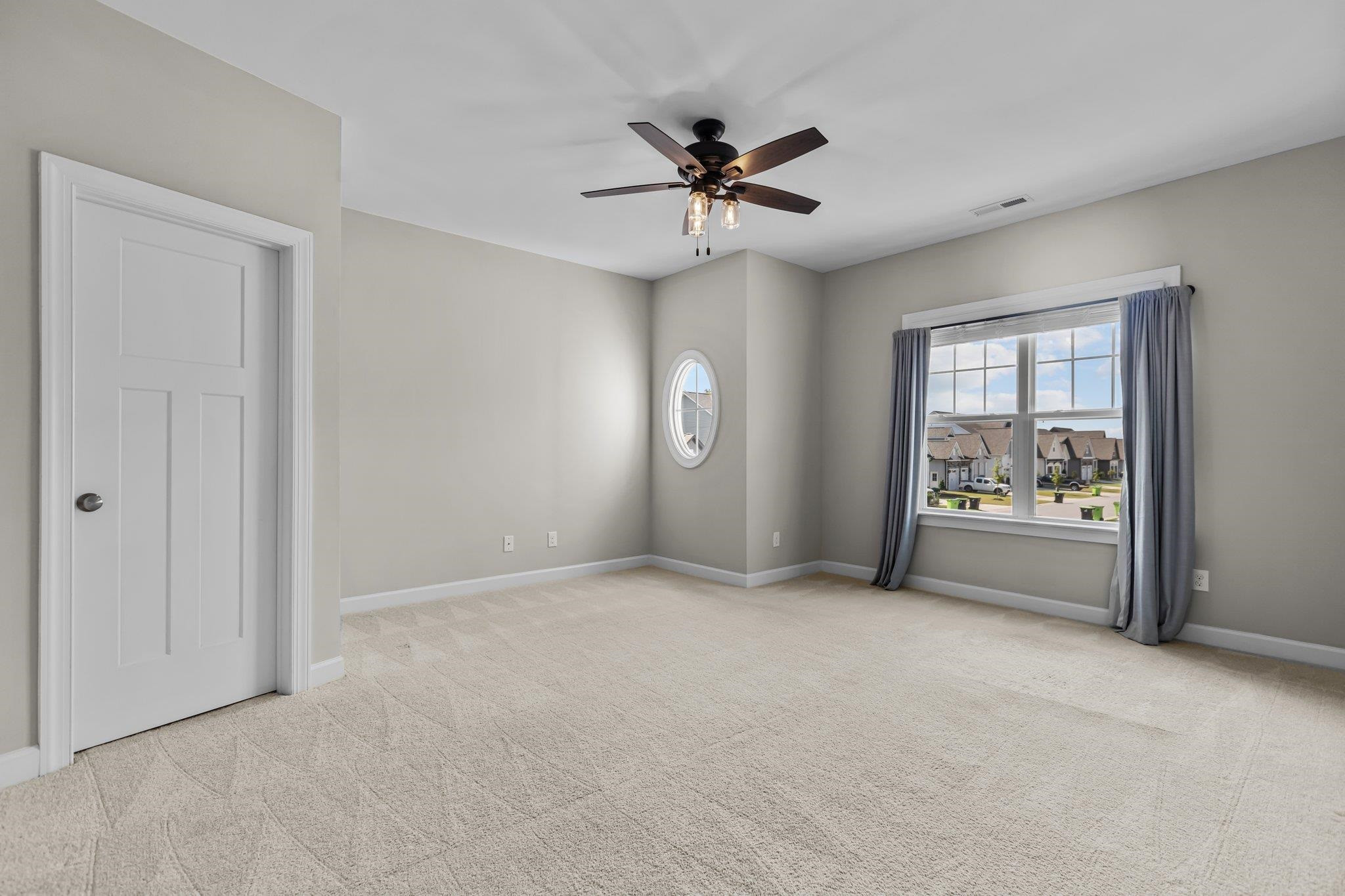 357 Marshcroft Way Rolesville, NC 27571 - Photo 32 of 52 a view of an empty room with a window