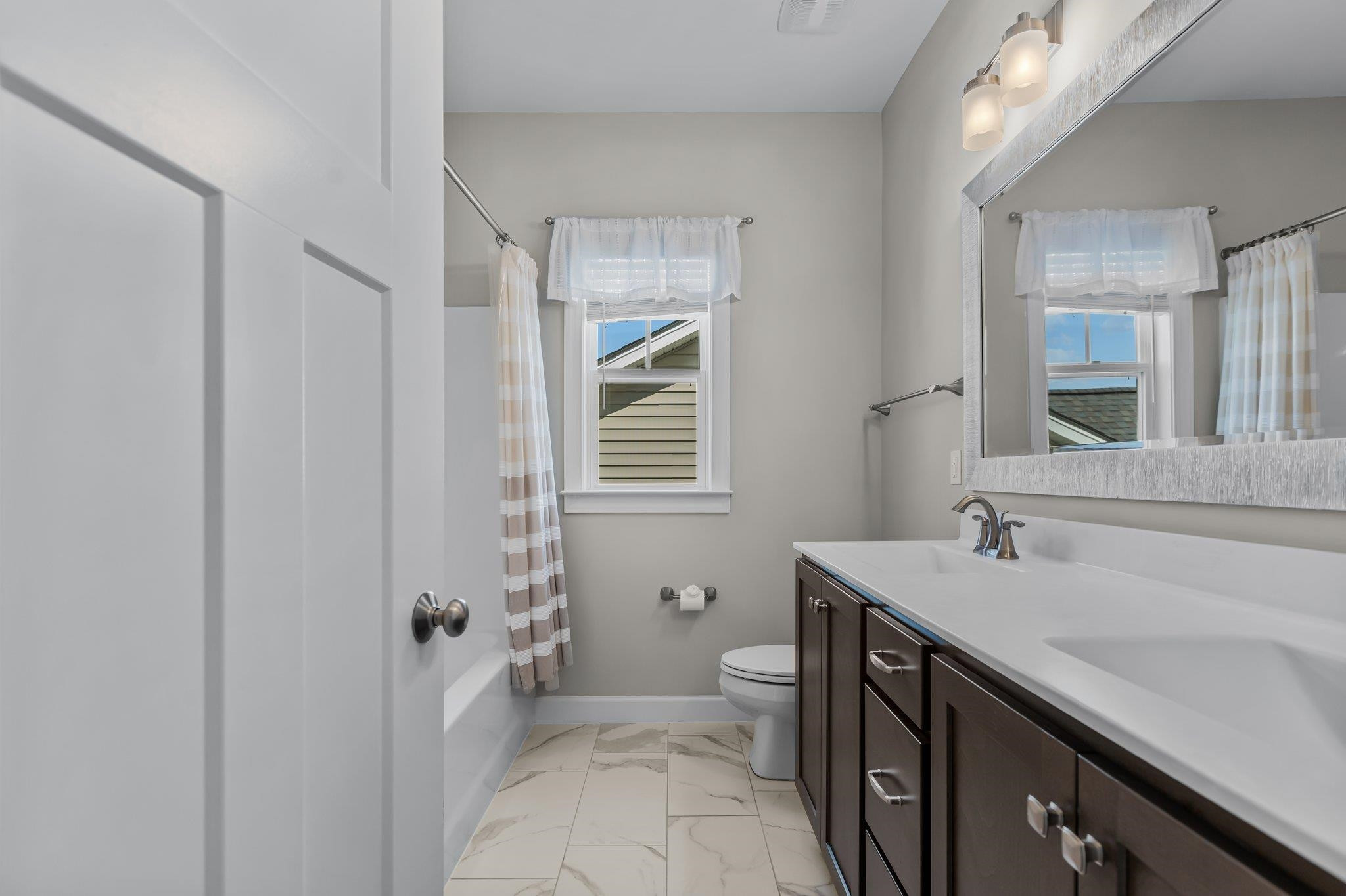 357 Marshcroft Way Rolesville, NC 27571 - Photo 34 of 52 a bathroom with a sink a toilet and shower