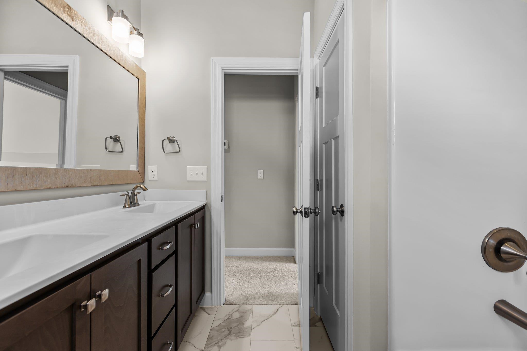 357 Marshcroft Way Rolesville, NC 27571 - Photo 35 of 52 a bathroom with a sink and a mirror