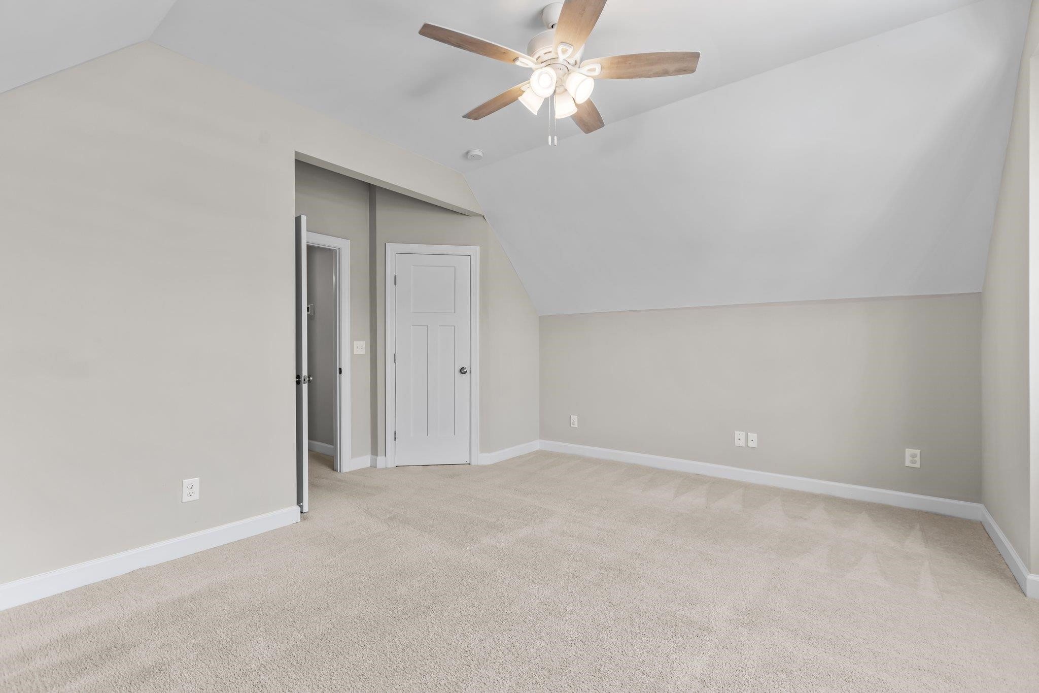 357 Marshcroft Way Rolesville, NC 27571 - Photo 37 of 52 an empty room with a ceiling fan and a window