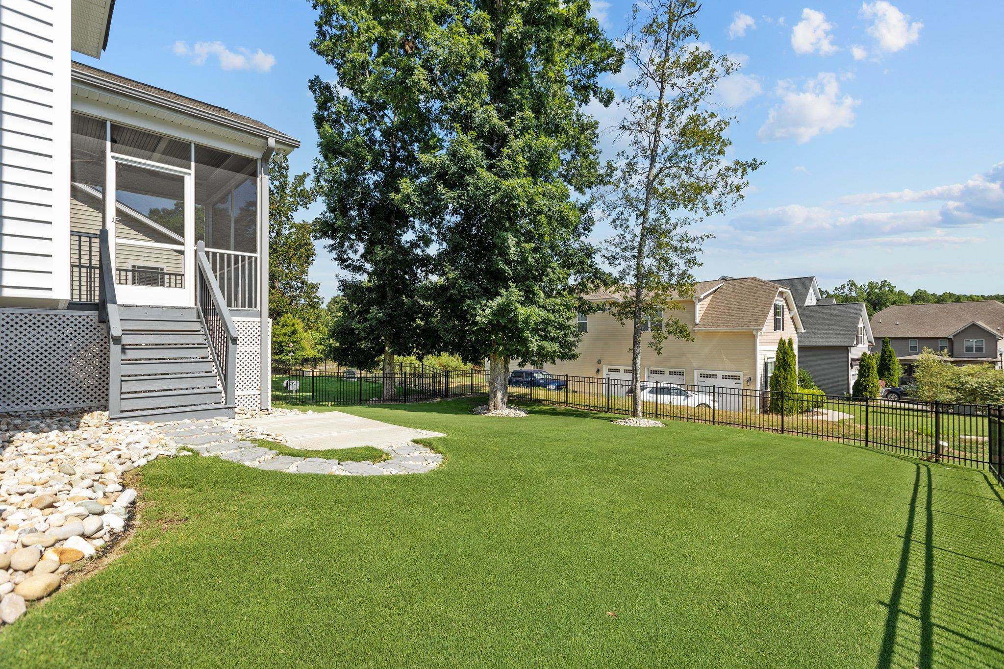 357 Marshcroft Way Rolesville, NC 27571 - Photo 41 of 52 a backyard of a house with table and chairs