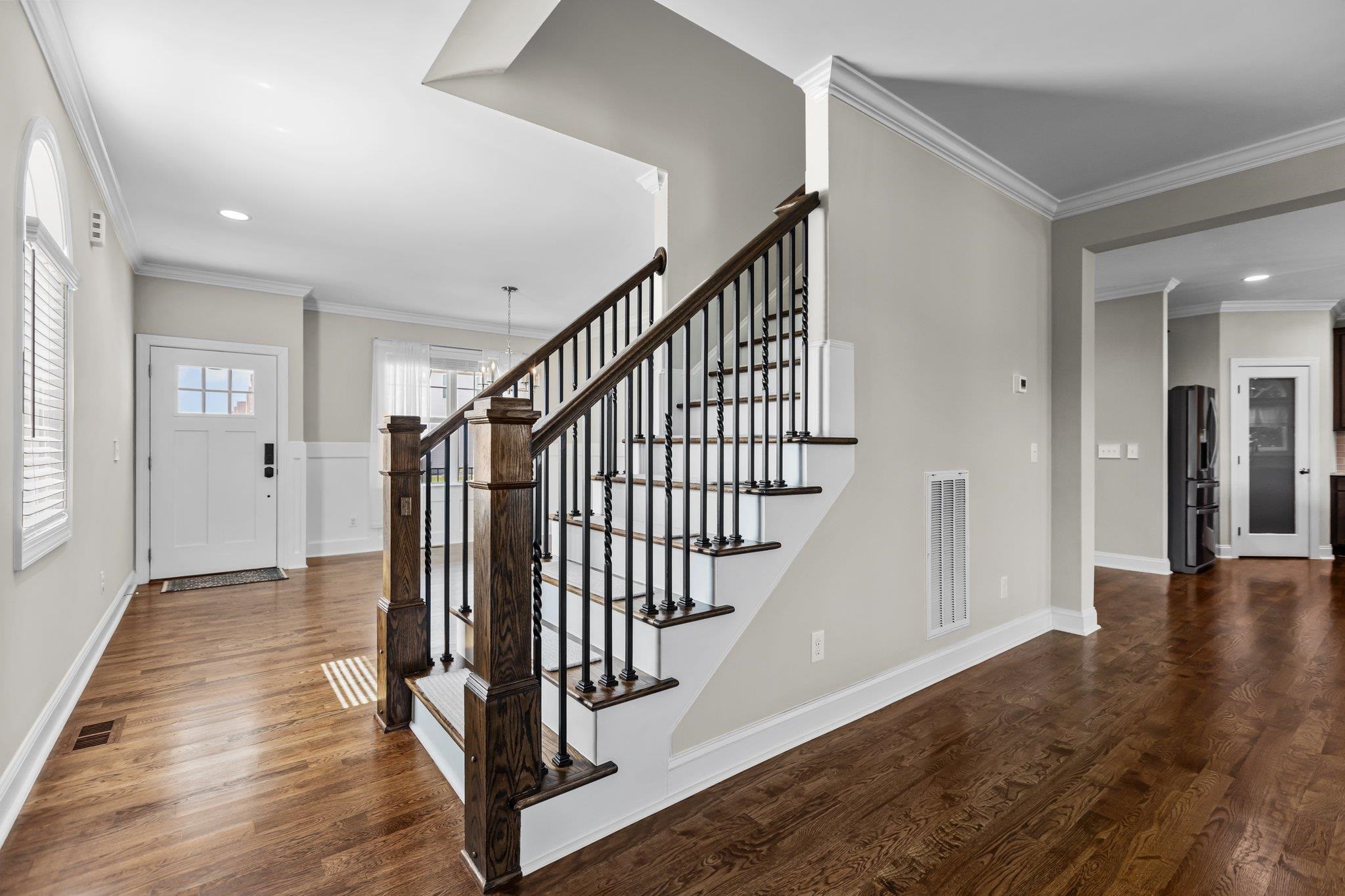 357 Marshcroft Way Rolesville, NC 27571 - Photo 8 of 52 a view of a hallway with wooden floor and stairs