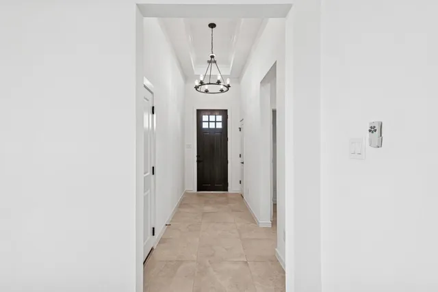 a view of a hallway with windows