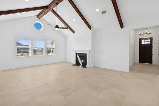 a view of an empty room with windows