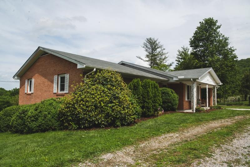 5072 Old Pike Road Pilot, VA 24138 - Photo 2 of 55 a front view of a house with a yard