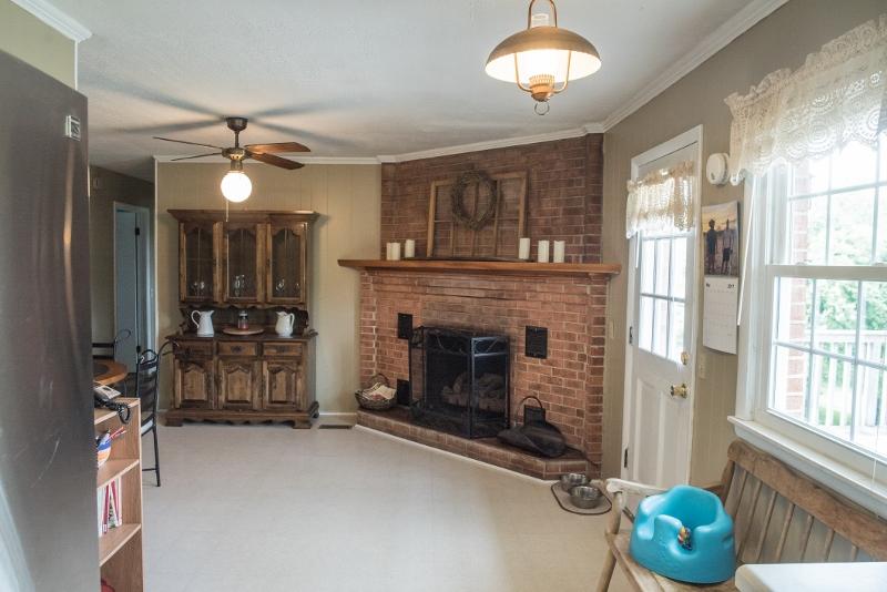 5072 Old Pike Road Pilot, VA 24138 - Photo 15 of 55 a living room with furniture and a fireplace