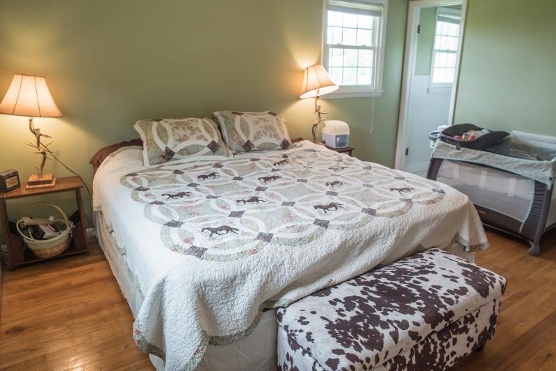 5072 Old Pike Road Pilot, VA 24138 - Photo 19 of 55 a bed sitting in a bedroom next to a window
