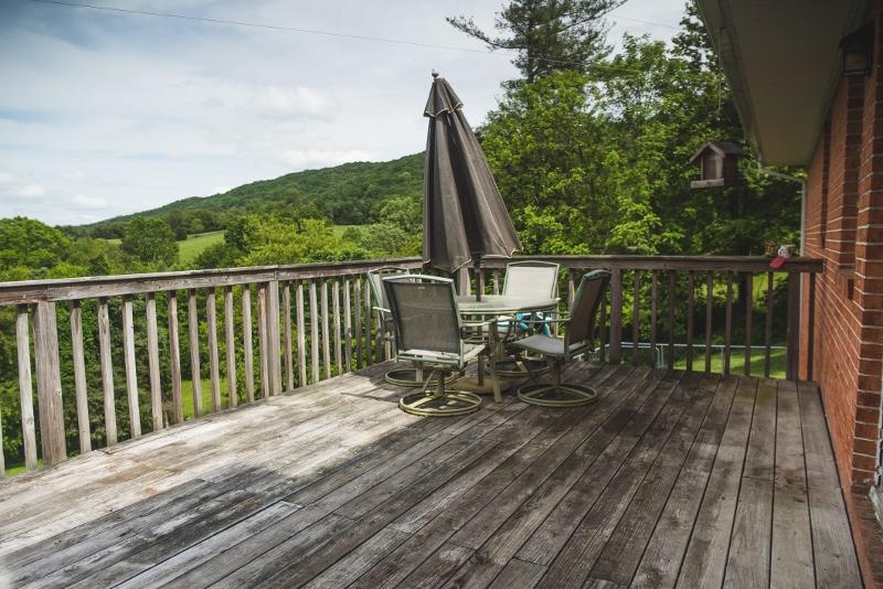 5072 Old Pike Road Pilot, VA 24138 - Photo 23 of 55 a view of balcony with wooden floor and outdoor seating